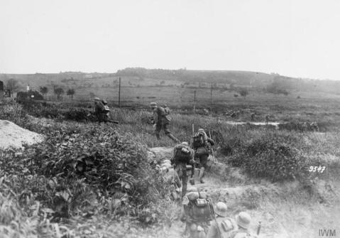 Image © IWM (Q 55009) – German infantry advancing in artillery formation on the Aisne canal.